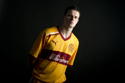 Motherwell ace David Clarkson kisses his jersey after his early